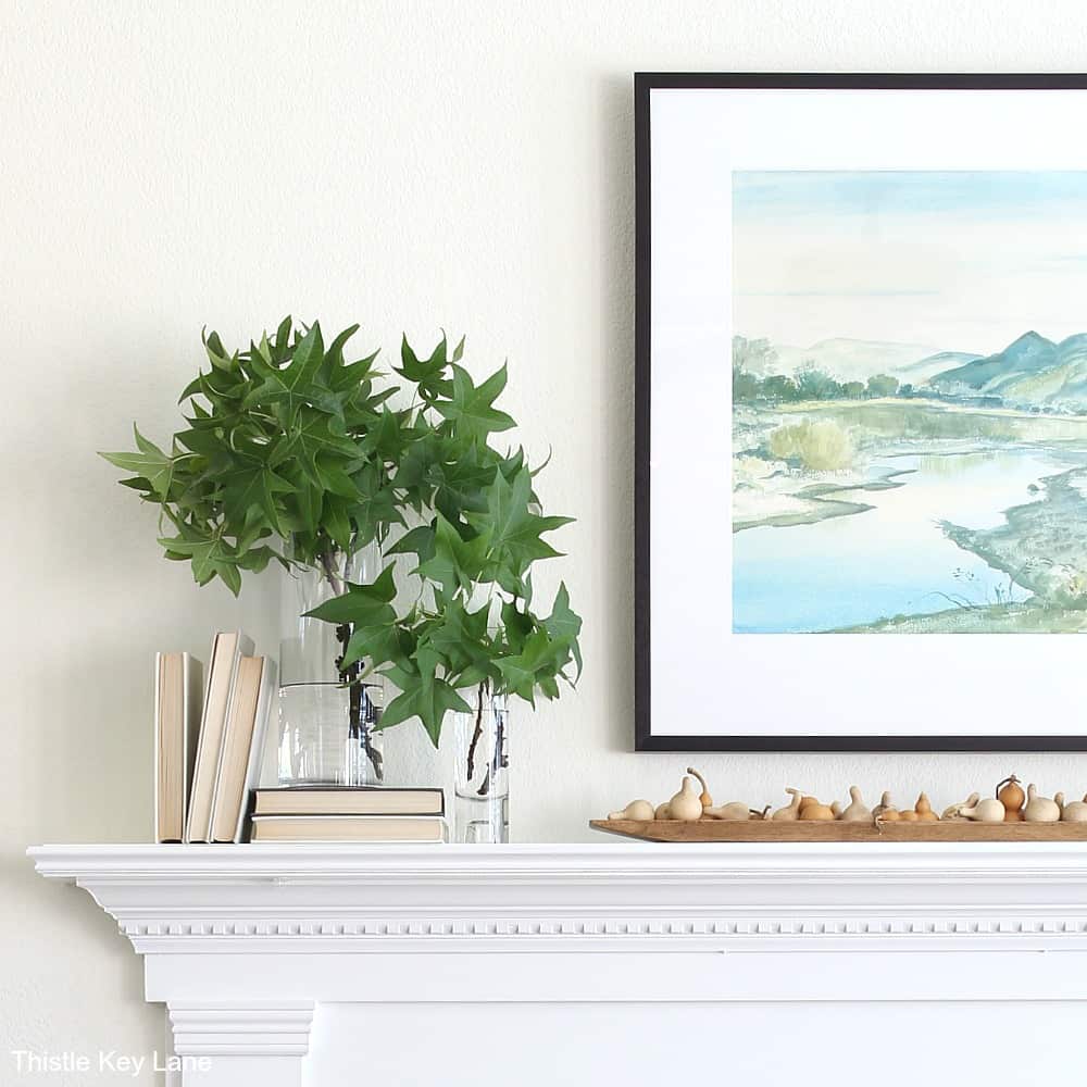 Simple Fall Mantel With Gourds And Greenery