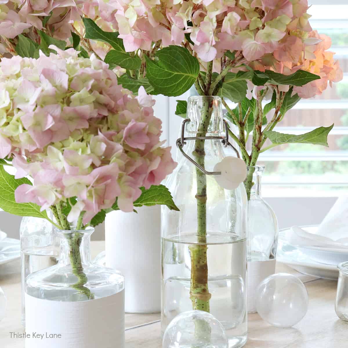 Summer Tablescape With Glass Bottle Vases