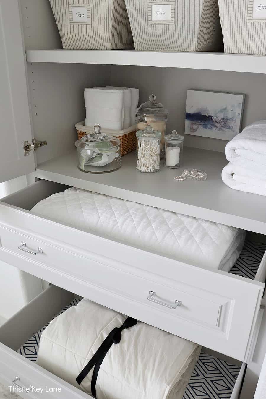 Drawers for storing quilts and comforters. 