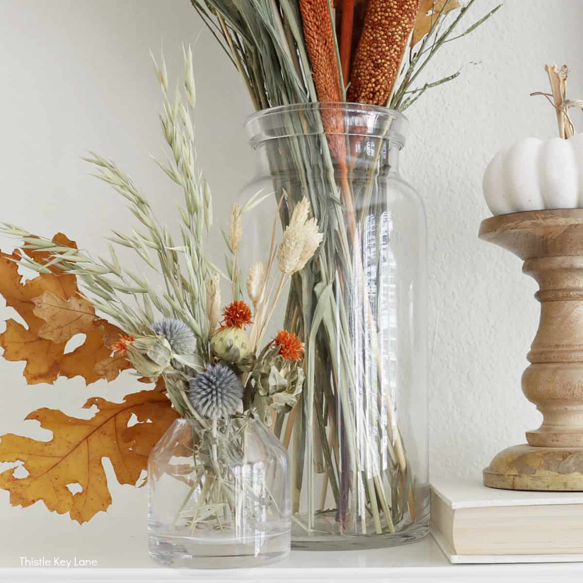 Seasonal floral arrangement on rustic mantle