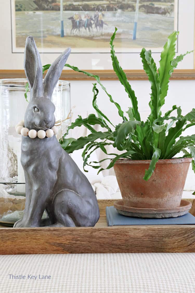 Hurricane candle holder, a rabbit and a fern. 