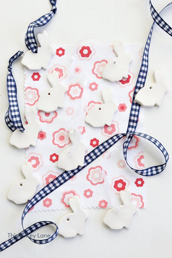Rabbits with ribbons to make ornaments. DIY Air Dry Clay Sheep And Rabbits.