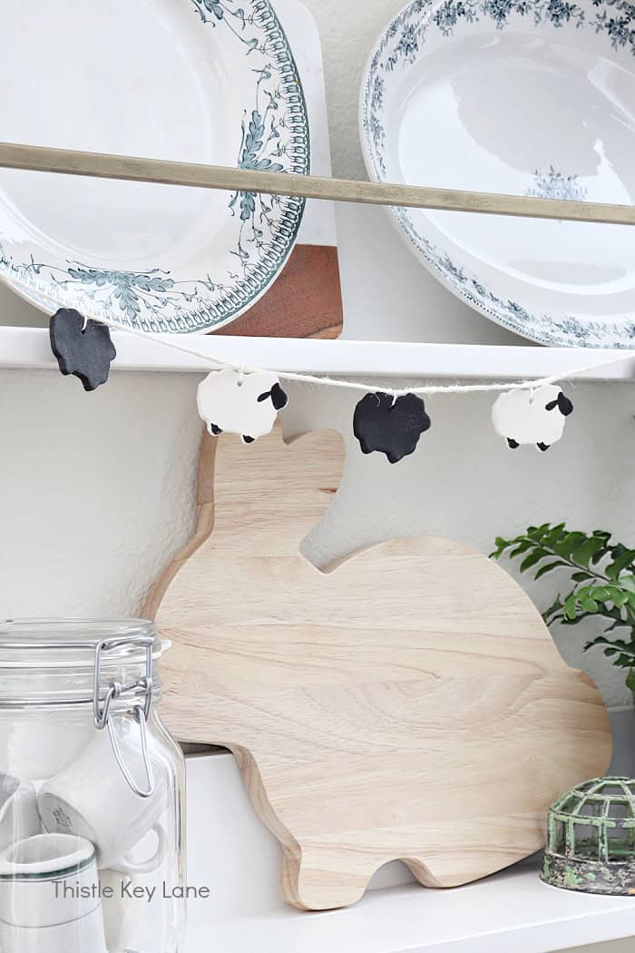 Plate rack with wood rabbit and sheep garland. DIY Air Dry Clay Sheep And Rabbits. 
