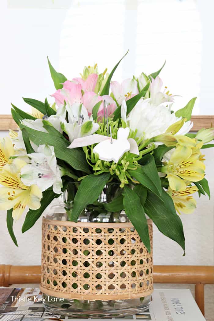 Spring arrangement with white, yellow and pink flowers. DIY Air Dry Clay Sheep And Rabbits.