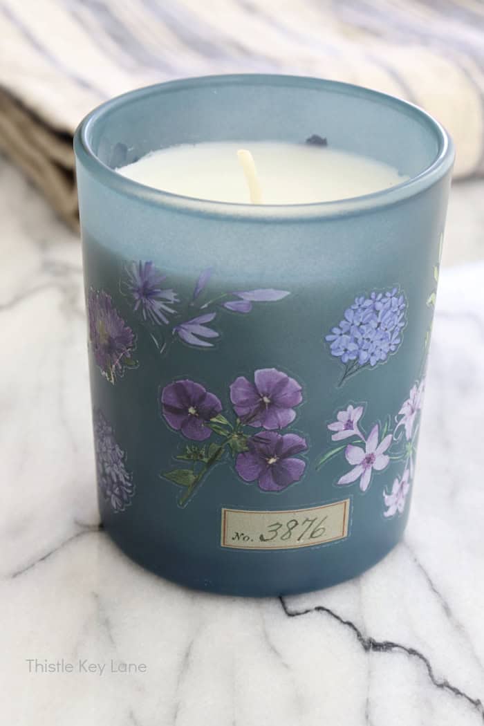Decorated candle with lavender flowers. Anthropologie Inspired Candles DIY.