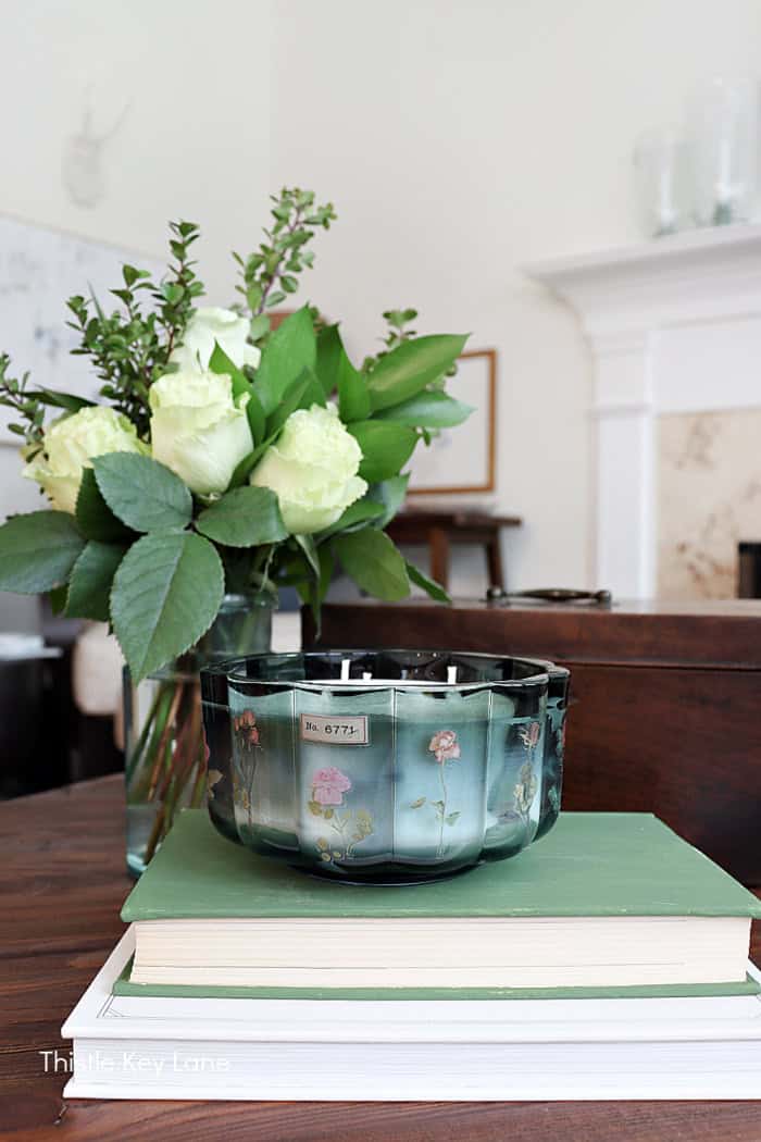 Candle on stack of books. Anthropologie Inspired Candles DIY.