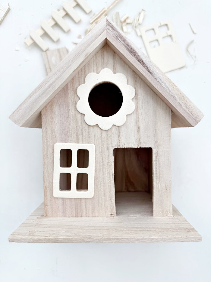 Bird house with fence and door opening enlarged.