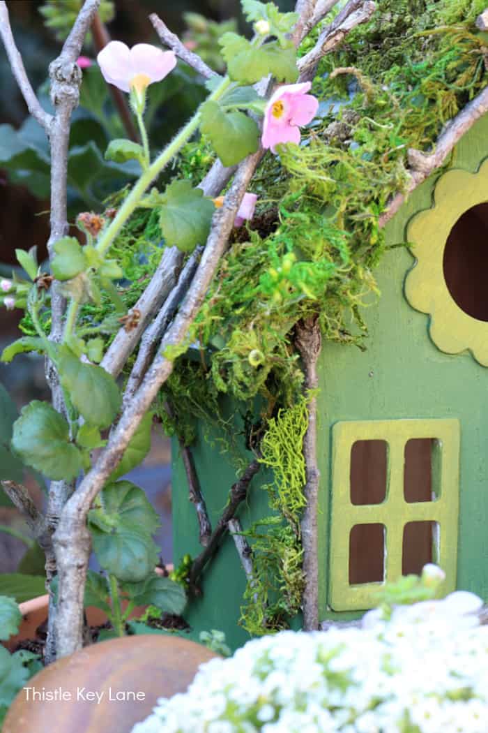 Side of fairy house with twig detail. How To Make A Flower Pot Fairy Garden.