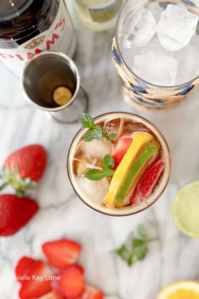 Mixed cocktail with garnishes. Pimm's Cup Cocktail Recipe.