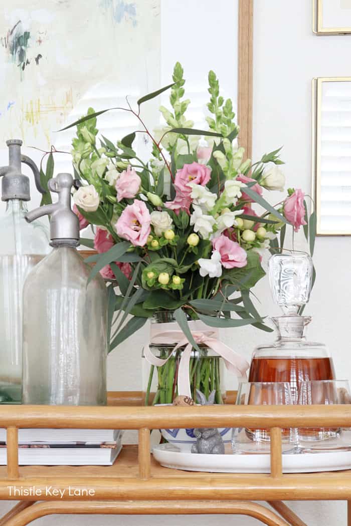 Pink and white flowers on a cart. Soft Neutrals Spring Home Tour.