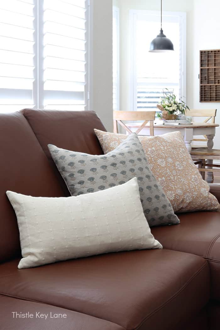 Variety of pillows on sofa.