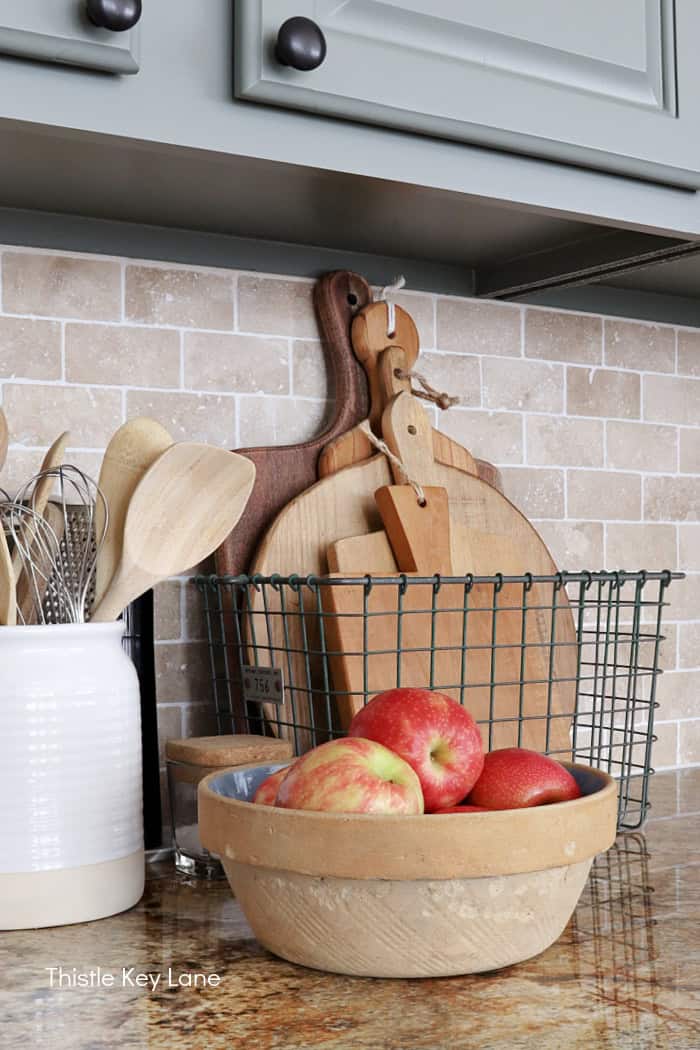Vintage bowl with apples and bread boards. Soft Neutrals Spring Home Tour.