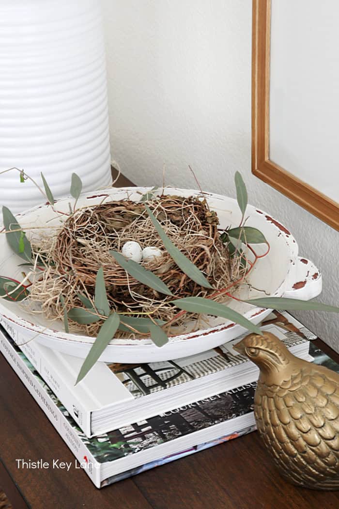 Bird nest arrangement in a wood bowl. Soft Neutrals Spring Home Tour.