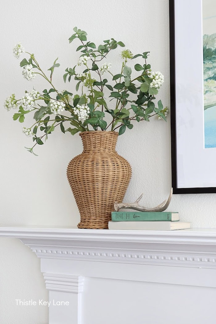 Wicker vase with faux flowers. Soft Neutrals Spring Home Tour.