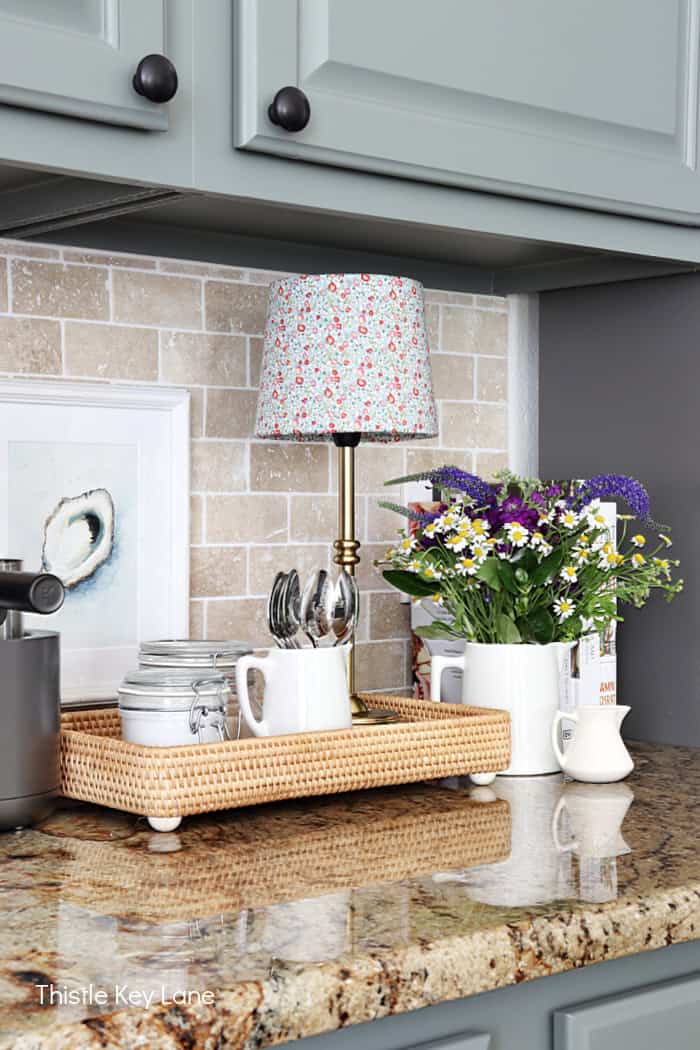 Coffee station with tray, lamp and flowers. Lampshade Update With Fabric.