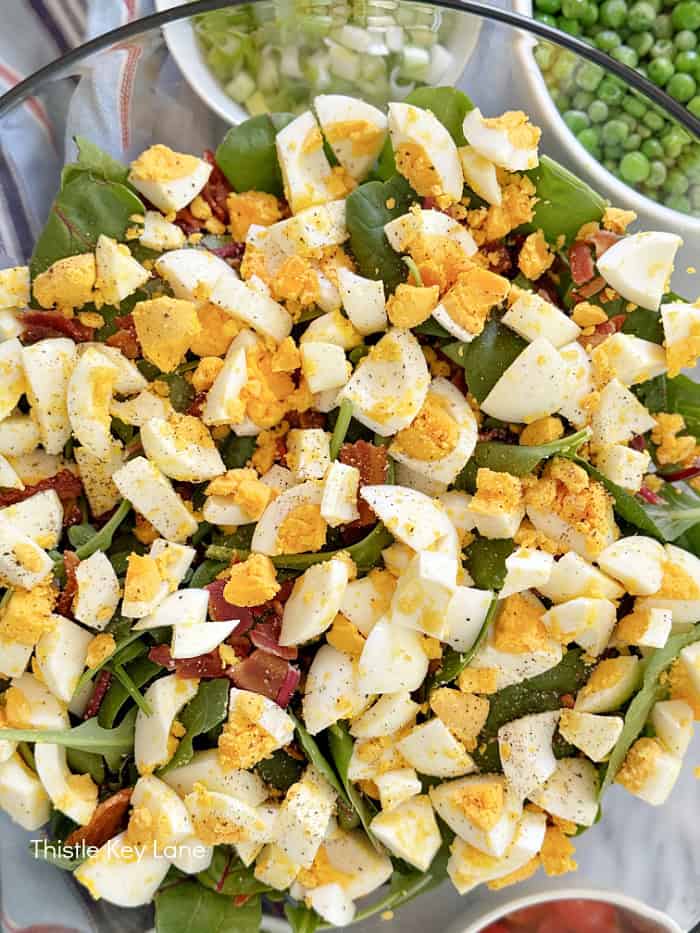 Salad with bacon and hard boiled eggs. Green Pea Layered Salad Recipe.