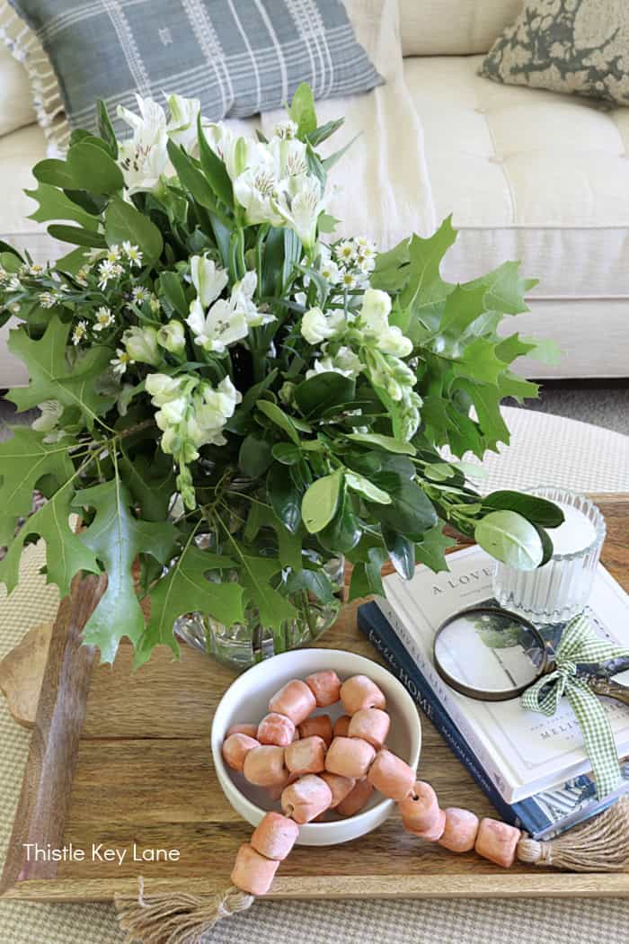Fresh flower arrangement with oak branches.