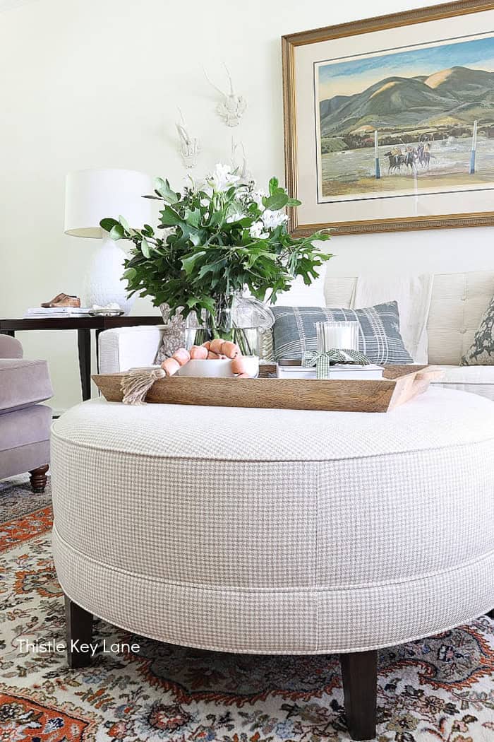 Round ottoman with tray arrangement. Summer Fresh Ottoman Styling.