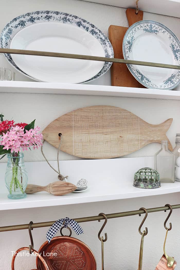 Kitchen shelf display with cutting board and plates. Cutting Board Wood Carving DIY.