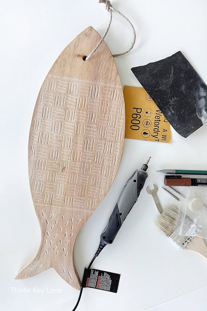 Fine sandpaper for wood carving. Cutting Board Wood Carving DIY.