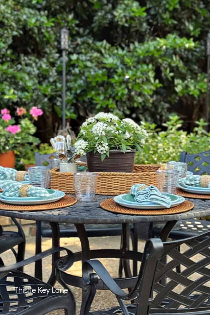 Summer tablescape in muted green and blue. Breezy Summer Patio Tour.