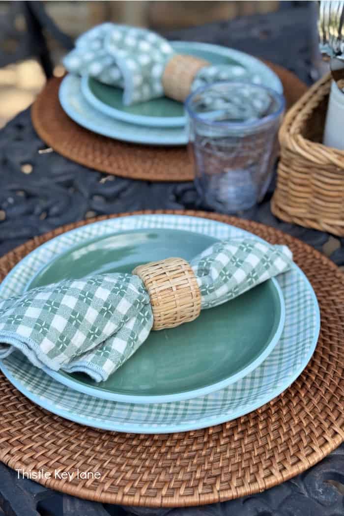 Plaid napkins and plates on outdoor table. Breezy Summer Patio Tour.