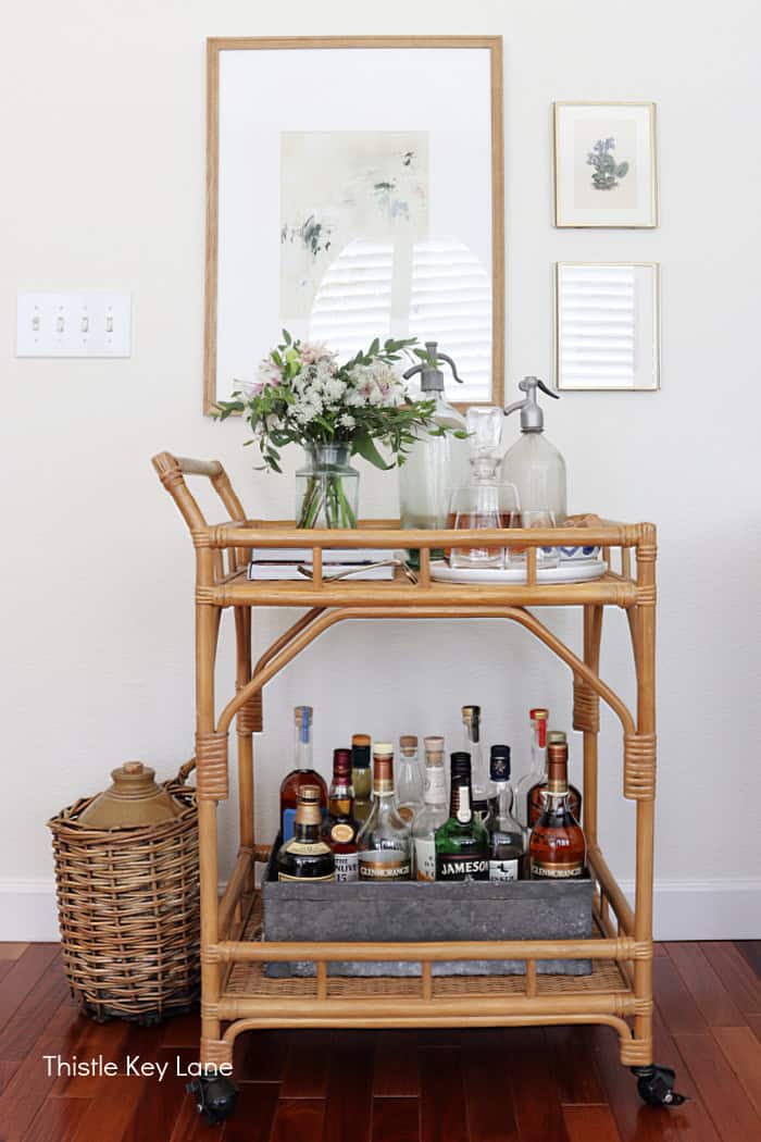 Bar cart with liquor bottles. Summer Family Room Cottage Styling.