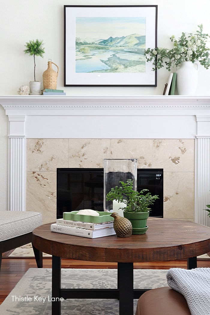 Coffe table and mantel decorated for summer. Summer Family Room Cottage Styling.