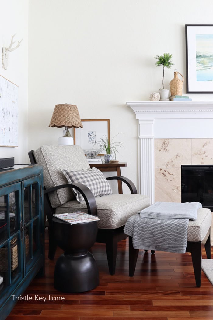 Arm chair with ottoman, lamp and table. Summer Family Room Cottage Styling.