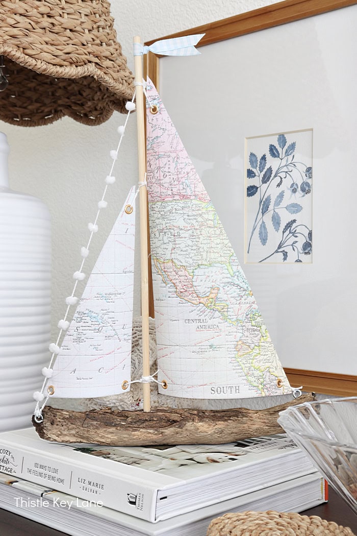 Boat with map sails on a stack of books. How To Make A Map Sailboat.