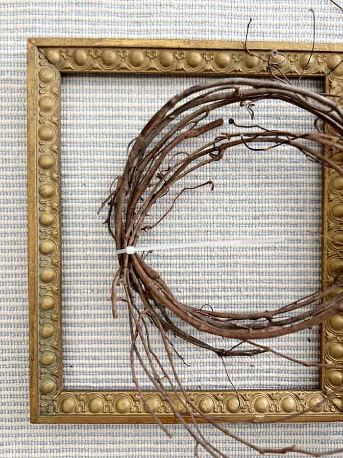 Zip tie grapevine pieces together.