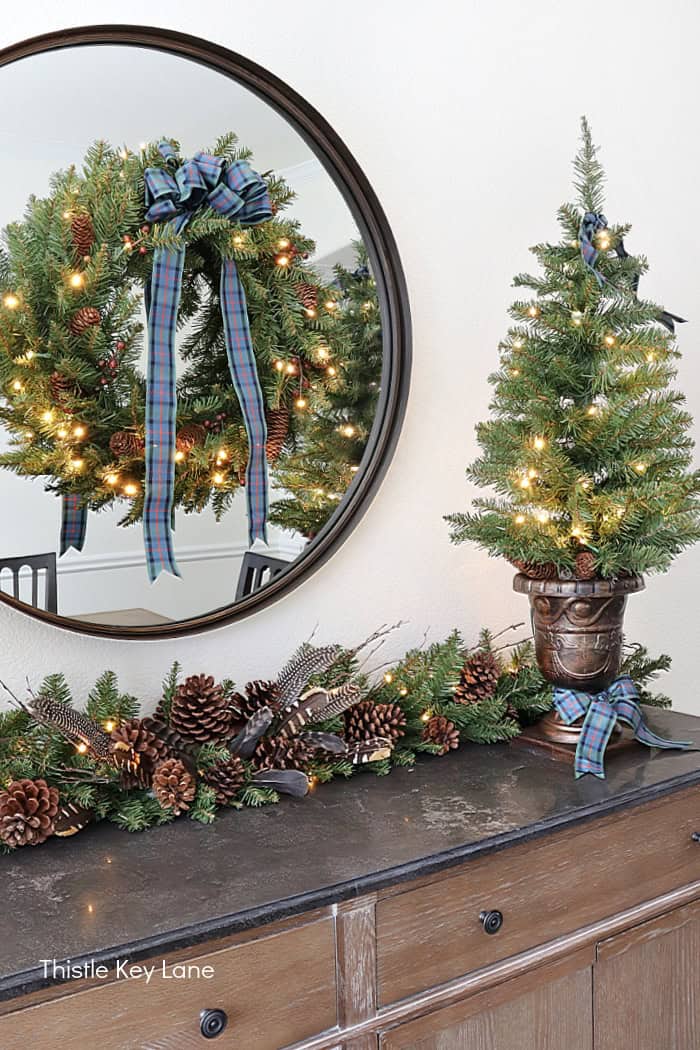 Beautiful pre-lit wreath with plaid blue and green bow. Easy Plan Ahead Christmas Decorating.