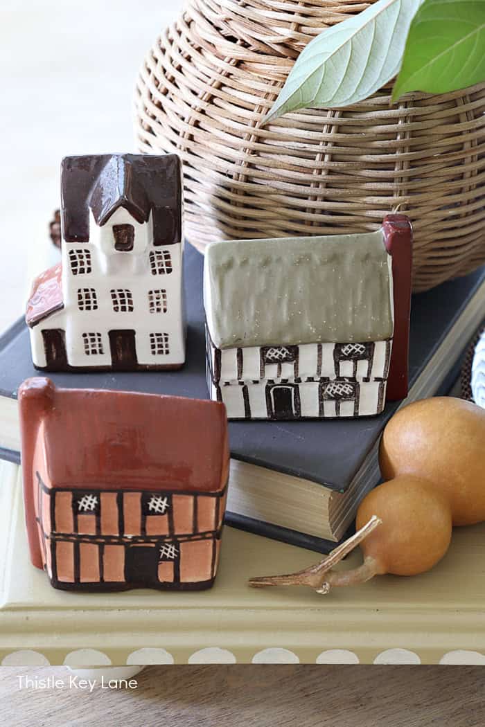 Display miniature houses on different levels in a vignette. Autumn Vintage Cottage Vignette.