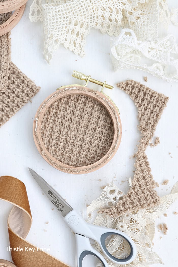 Trim off excess material with sharp scissors. Embroidery Hoop Ornaments From Sweaters.