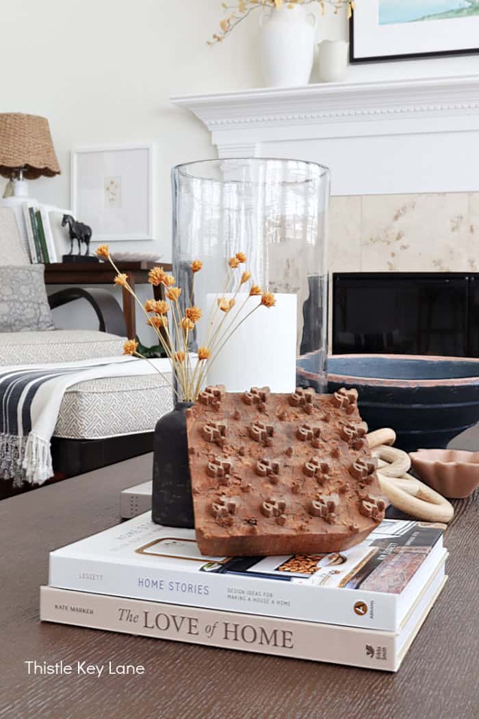 Vintage decor with books and candles. Cozy Autumn Family Room Decor.