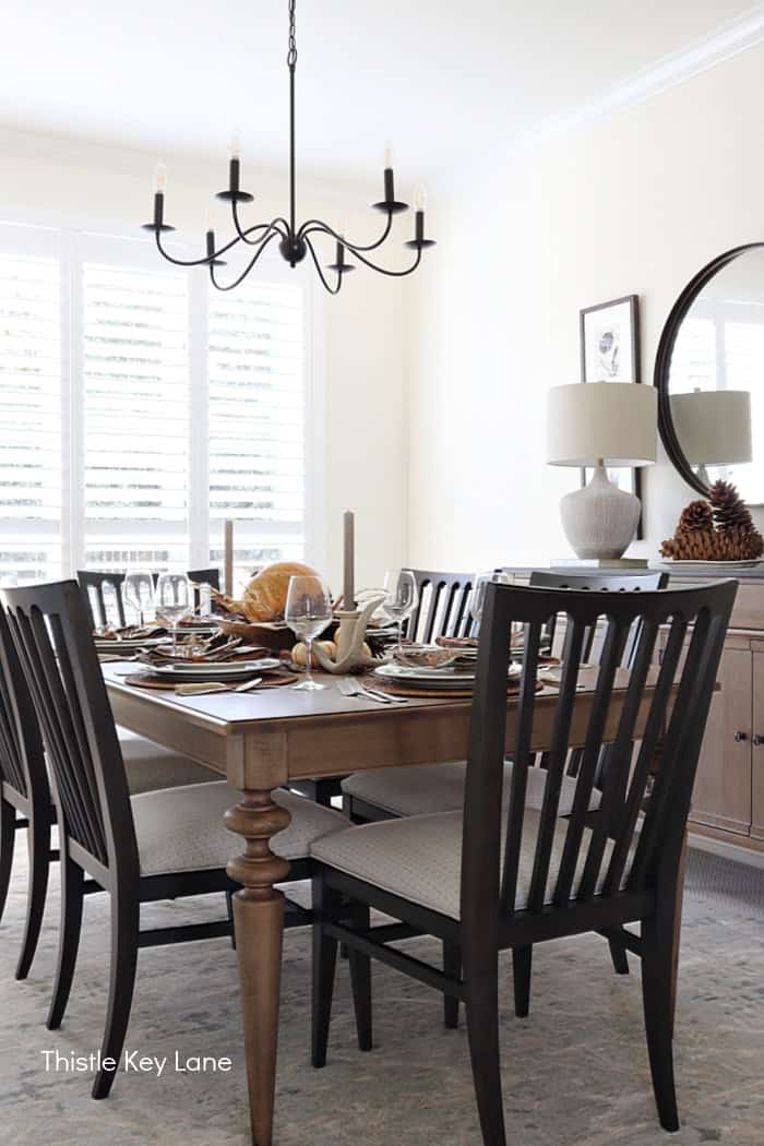 Dark dining room chairs and festive holiday table.