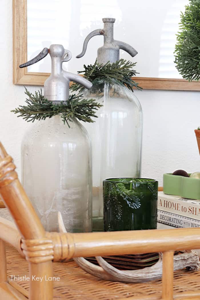 Vintage bottles with greenery.