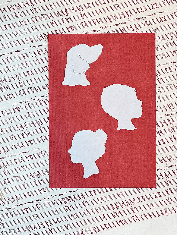 Using red colored paper for silhouettes. DIY Silhouette Keepsake Ornaments.