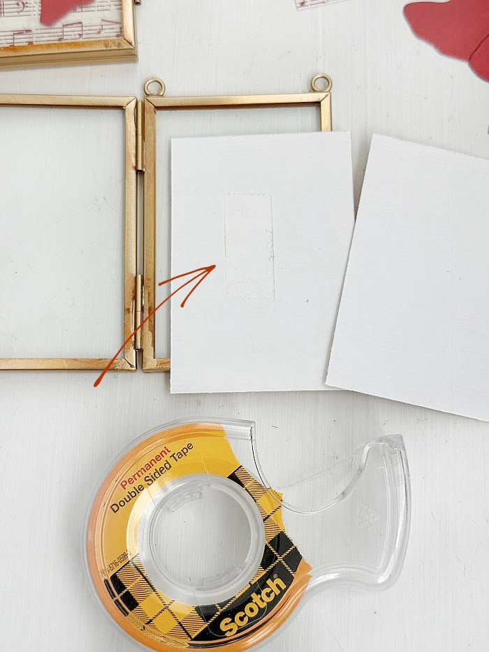 Using tape to assemble ornaments. DIY Silhouette Keepsake Ornaments.