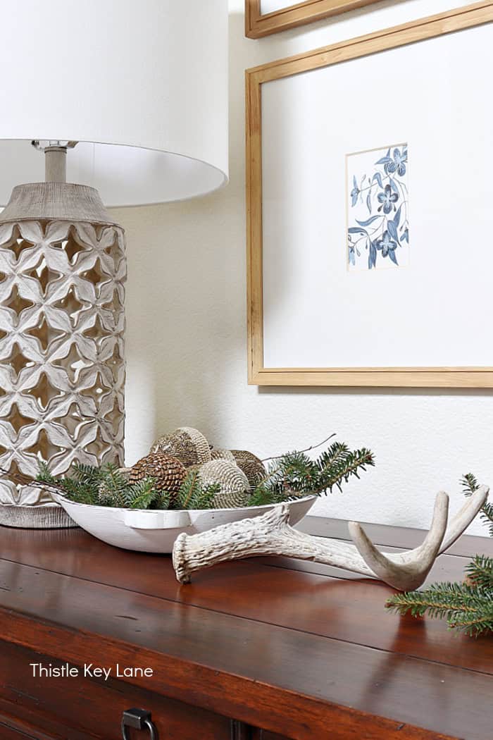 Bowl holding ornaments and a deer shed.