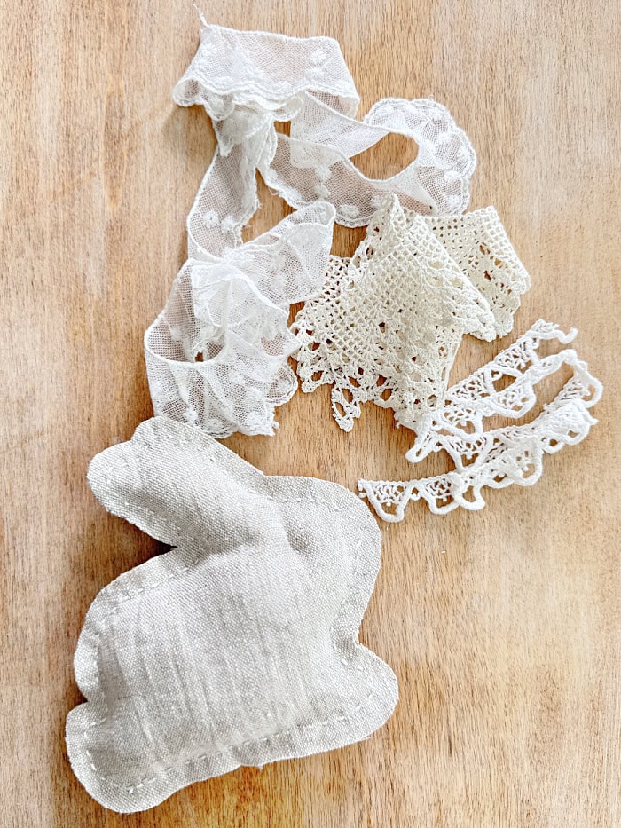 Lace trim for embellishing on a pillow. DIY Lace Bunny And Carrot Pillows.