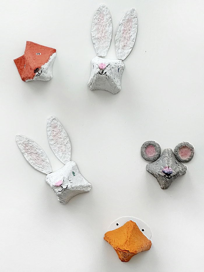 Animal heads with ears and painted on details.