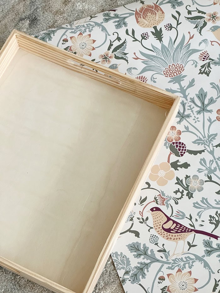 Wallpaper and a wood tray on top.