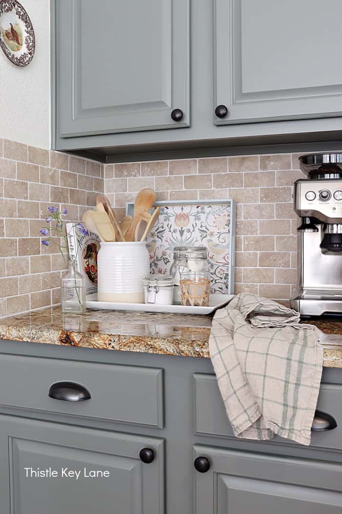 Organizing a counter with trays. How To Decorate A Tray With Wallpaper.