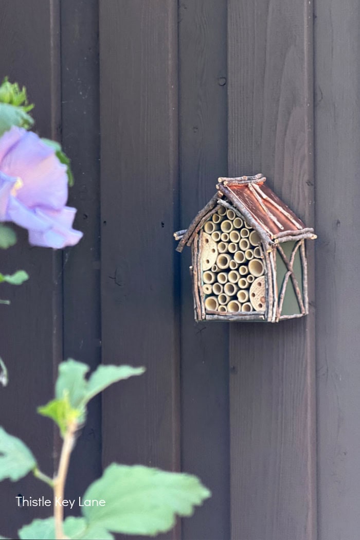 Bee house on a fence. Create A Fancy Bee Hotel.