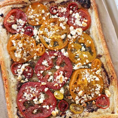 Yellow and red tomatoes with cheese. Tomato Pesto Puff Pastry Tart.