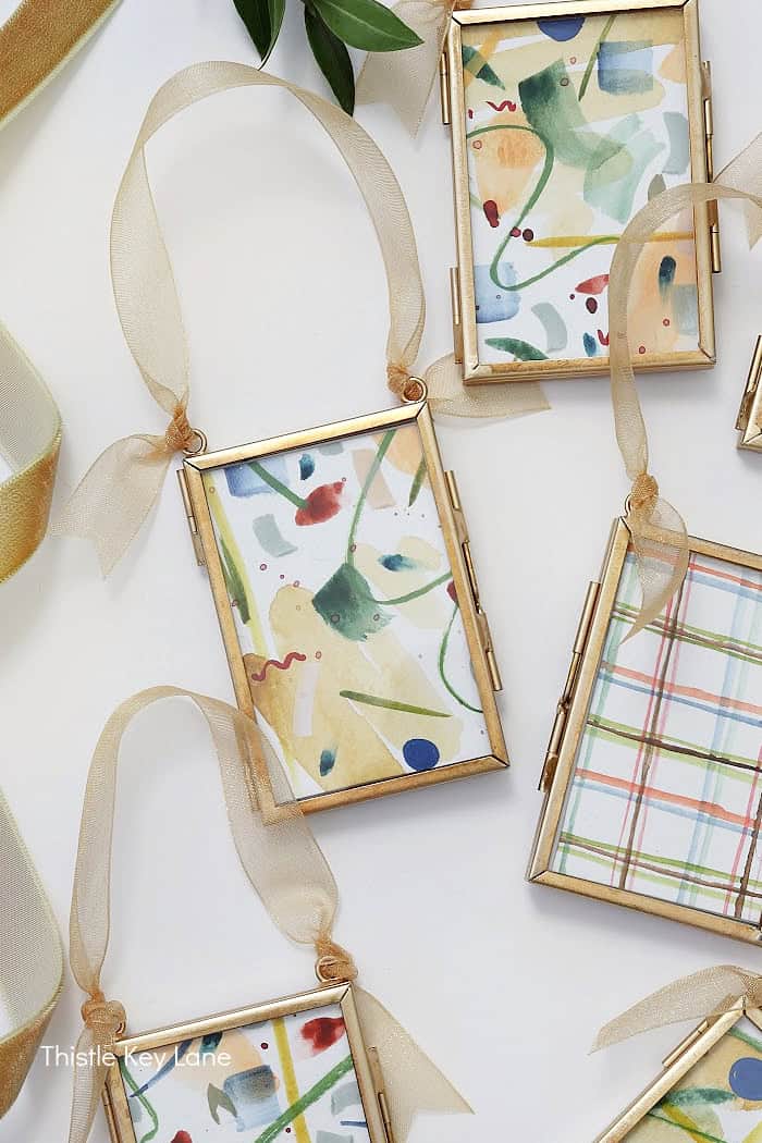 Close up of artwork in a frame with ribbon. Frame Abstract Ornaments.