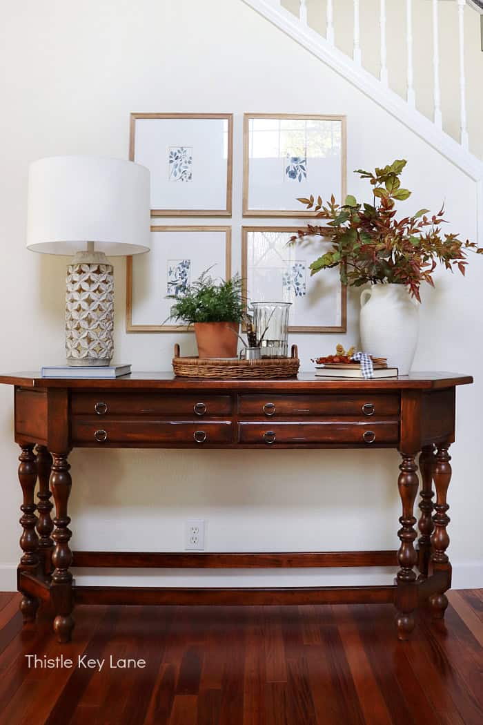 Entry table with early fall accessories. Early Fall Entry Table With Greenery.