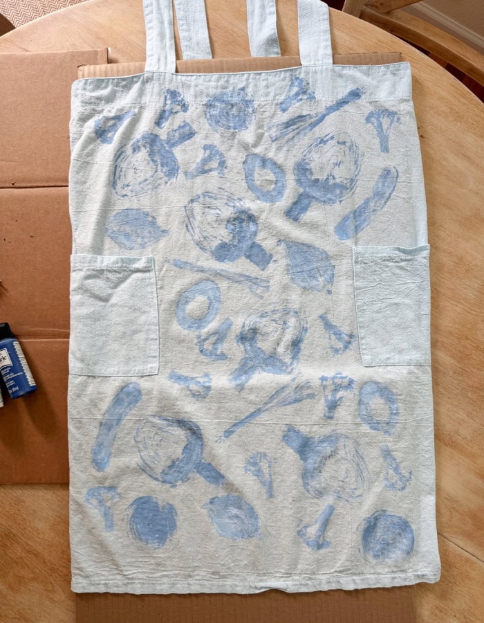 Wet paint after vegetable stamping on fabric. DIY Vegetable Stamped Apron.