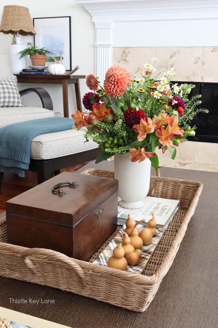 Wicker tray with antique box, gourds and flowers. Mixing In Cozy Fall Decor.
